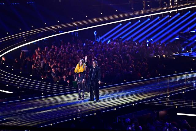 Austrian presenters Victoria Swarovski and Michael Ostrowski greet the audience during a dress rehearsal for the second semi-final of the Eurovision Song Contest 2026 (ESC) at Wiener Stadthalle in Vienna, Austria on May 13, 2026. (Photo by Tobias SCHWARZ / AFP)