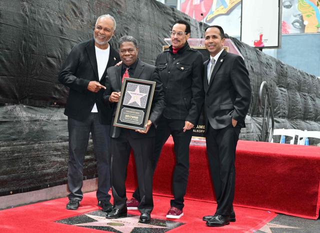 (L/R) US singer Ray Parker Jr., Brazilian percussionist Paulinho da Costa, US musician Larry Dunn and Paolo Da Costa pose on Paulinho da Costa's star during his Walk of Fame ceremony in Hollywood, California on May 13, 2026. (Photo by Frederic J. Brown / AFP)