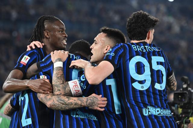 Inter Milan's Argentine forward #10 Lautaro Martinez (C) and Inter players celebrate after opening the scoring during the Italian Cup (Coppa Italia) final football match between Lazio Rome and Inter Milan at the Olympic stadium in Rome on May 13, 2026. (Photo by Isabella BONOTTO / AFP)