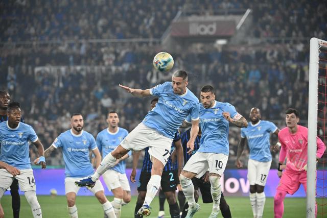 Lazio's Montenegrin defender #77 Adam Marusic heads the ball as he defends inside his side's box during the Italian Cup (Coppa Italia) final football match between Lazio Rome and Inter Milan at the Olympic stadium in Rome on May 13, 2026. (Photo by Isabella BONOTTO / AFP)
