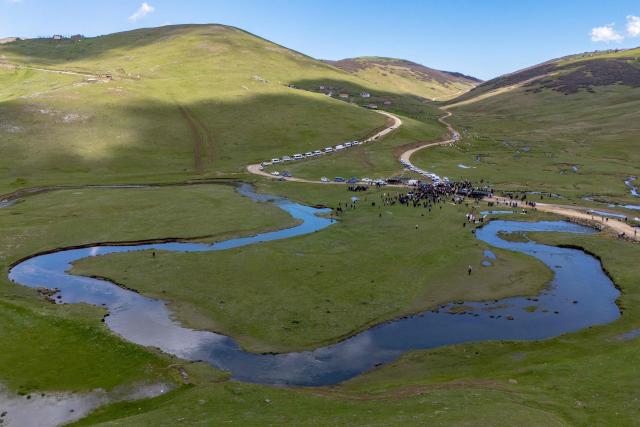 This aerial view shows protesters gathering during a protest march against mining at the Aybasti Plateau in Ordu Province, northeastern Turkey, on May 8, 2026. With Turkey hosting COP31 in November 2026, its own environmental record is being scrutinised, with activists warning about the growing number of water-intensive mining projects as resources dry up. (Photo by Yasin AKGUL / AFP) / TO GO WITH AFP STORY by BURC?N GERCEK