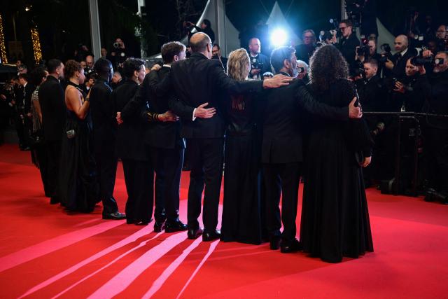 The team of the film "L'Abandon" poses for photographers as they arrive for the screening of the film "L'Abandon" at the 79th edition of the Cannes Film Festival in Cannes, southern France on May 13, 2026. (Photo by Olivier CHASSIGNOLE / AFP)