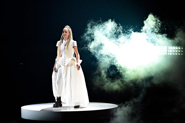France's singer Monroe Vata Rigby, aka Monroe and representing France with the song 'Regarde !', performs during a dress rehearsal for the second semi-final of the Eurovision Song Contest 2026 (ESC) at Wiener Stadthalle in Vienna, Austria on May 13, 2026. (Photo by Tobias SCHWARZ / AFP)