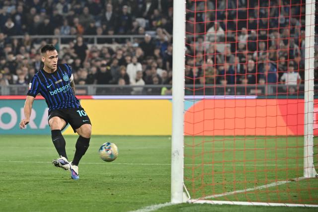 Inter Milan's Argentine forward #10 Lautaro Martinez scores his side's second goal during the Italian Cup (Coppa Italia) final football match between Lazio Rome and Inter Milan at the Olympic stadium in Rome on May 13, 2026. (Photo by Isabella BONOTTO / AFP)