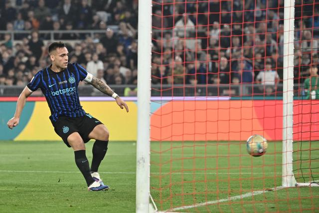 TOPSHOT - Inter Milan's Argentine forward #10 Lautaro Martinez scores his side's second goal during the Italian Cup (Coppa Italia) final football match between Lazio Rome and Inter Milan at the Olympic stadium in Rome on May 13, 2026. (Photo by Isabella BONOTTO / AFP)