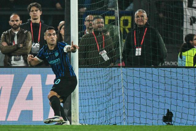 Inter Milan's Argentine forward #10 Lautaro Martinez celebrates after scoring his side's second goal during the Italian Cup (Coppa Italia) final football match between Lazio Rome and Inter Milan at the Olympic stadium in Rome on May 13, 2026. (Photo by Alberto PIZZOLI / AFP)