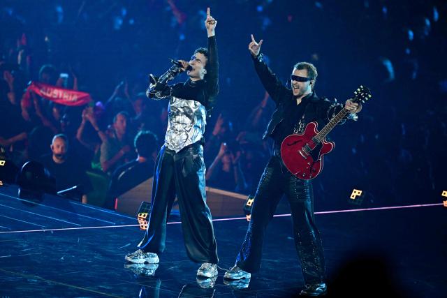 Austrian singer Benjamin Gedeon, aka Cosmo and representing Austria with the song 'Tanzschein', performs during a dress rehearsal for the second semi-final of the Eurovision Song Contest 2026 (ESC) at Wiener Stadthalle in Vienna, Austria on May 13, 2026. (Photo by Tobias SCHWARZ / AFP)