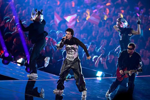 Austrian singer Benjamin Gedeon, aka Cosmo and representing Austria with the song 'Tanzschein', performs during a dress rehearsal for the second semi-final of the Eurovision Song Contest 2026 (ESC) at Wiener Stadthalle in Vienna, Austria on May 13, 2026. (Photo by Tobias SCHWARZ / AFP)