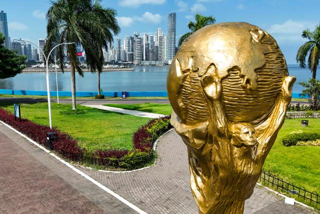 This aerial view shows a giant replica of the FIFA World Cup trophy at the Cinta Costera in Panama City on May 13, 2026. Panama will play in the FIFA World Cup hosted by the United States, Mexico, and Canada from June 11 to July 19, 2026. (Photo by Martin BERNETTI / AFP)