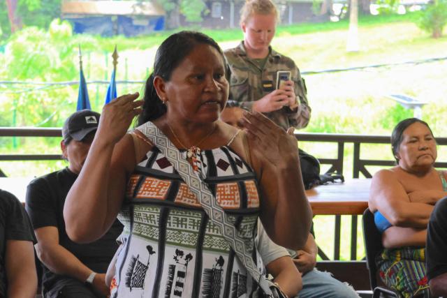 Local resident Franocise Renaud speaks during a meeting with the prefectural delegation in Camopi, a town on the border with Brazil in the French overseas department of Guiana, on May 11, 2026, where residents are protesting against the increasingly frequent border crossings by illegal gold miners. (Photo by Guillaume REUGE / AFP)