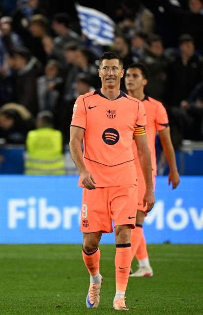 Barcelona's Polish forward #09 Robert Lewandowski reacts to the opening goal scored by Alaves' Ivorian forward #22 Ibrahim Diabate during the Spanish league football match between Deportivo Alaves and FC Barcelona at Mendizorroza Stadium in Vitoria on May 13, 2026. (Photo by ANDER GILLENEA / AFP)