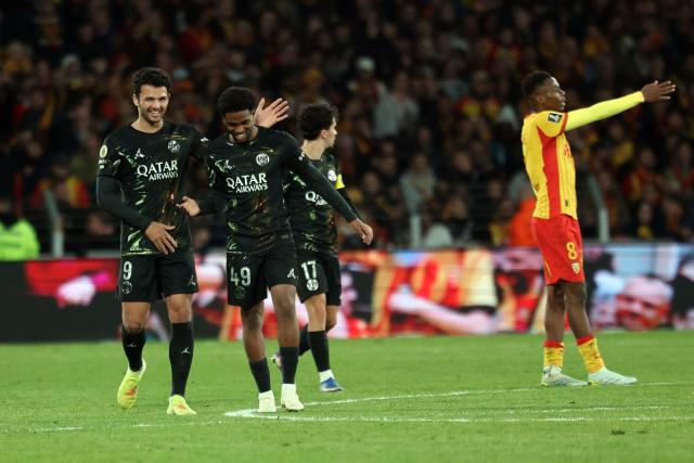 Paris Saint-Germain's French forward #49 Ibrahim Mbaye (C) celebrates after scoring a goal during the French L1 football match between RC Lens and Paris Saint-Germain (PSG) at the Stade Bollaert-Delelis stadium in Lens on May 13, 2026. (Photo by Francois LO PRESTI / AFP)