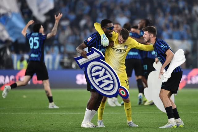 Inter Milan's French forward #09 Marcus Thuram (C), Inter Milan's Spanish goalkeeper #13 Josep Martinez and Inter Milan's Croatian midfielder #08 Petar Sucic celebrate after winning the Italian Cup (Coppa Italia) final football match between Lazio Rome and Inter Milan at the Olympic stadium in Rome on May 13, 2026. (Photo by Isabella BONOTTO / AFP)