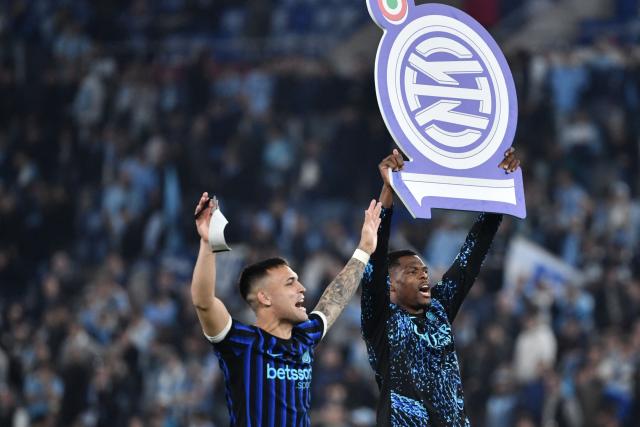 Inter Milan's Argentine forward #10 Lautaro Martinez and Inter Milan's Dutch defender #02 Denzel Dumfries celebrate after Inter won the Italian Cup (Coppa Italia) final football match between Lazio Rome and Inter Milan at the Olympic stadium in Rome on May 13, 2026. (Photo by Isabella BONOTTO / AFP)