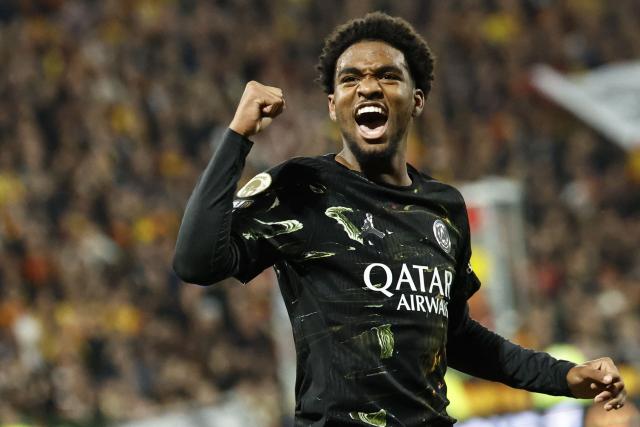 Paris Saint-Germain's French forward #49 Ibrahim Mbaye celebrates after scoring a goal during the French L1 football match between RC Lens and Paris Saint-Germain (PSG) at the Stade Bollaert-Delelis stadium in Lens on May 13, 2026. (Photo by SIMON WOHLFAHRT / AFP)