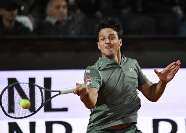 Italy's Luciano Darderi hits a return to Spain's Rafael Jodar during the ATP Rome Open tennis tournament at Foro Italico in Rome on May 13, 2026. (Photo by Tiziana FABI / AFP)