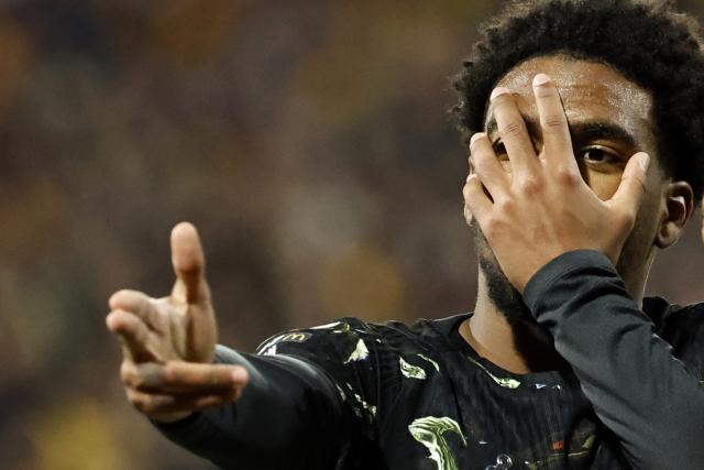 Paris Saint-Germain's French forward #49 Ibrahim Mbaye celebrates after scoring a goal during the French L1 football match between RC Lens and Paris Saint-Germain (PSG) at the Stade Bollaert-Delelis stadium in Lens on May 13, 2026. (Photo by SIMON WOHLFAHRT / AFP)