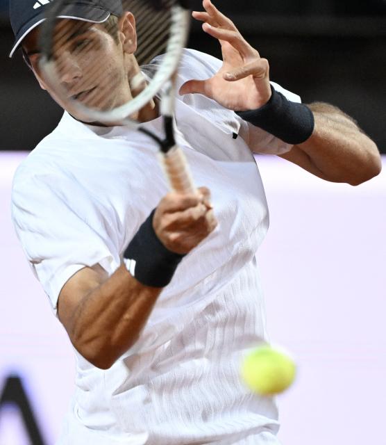 Spain's Rafael Jodar hits a return to Italy's Luciano Darderi during the ATP Rome Open tennis tournament at Foro Italico in Rome on May 13, 2026. (Photo by Tiziana FABI / AFP)