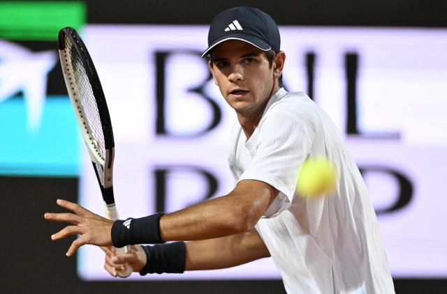 Spain's Rafael Jodar hits a return to Italy's Luciano Darderi during the ATP Rome Open tennis tournament at Foro Italico in Rome on May 13, 2026. (Photo by Tiziana FABI / AFP)