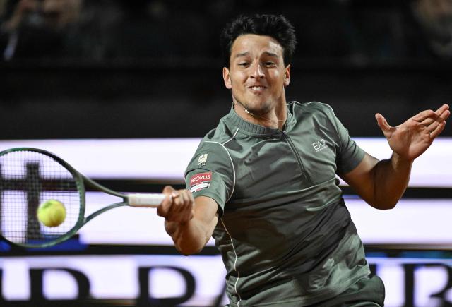 Italy's Luciano Darderi hits a return to Spain's Rafael Jodar during the ATP Rome Open tennis tournament at Foro Italico in Rome on May 13, 2026. (Photo by Tiziana FABI / AFP)