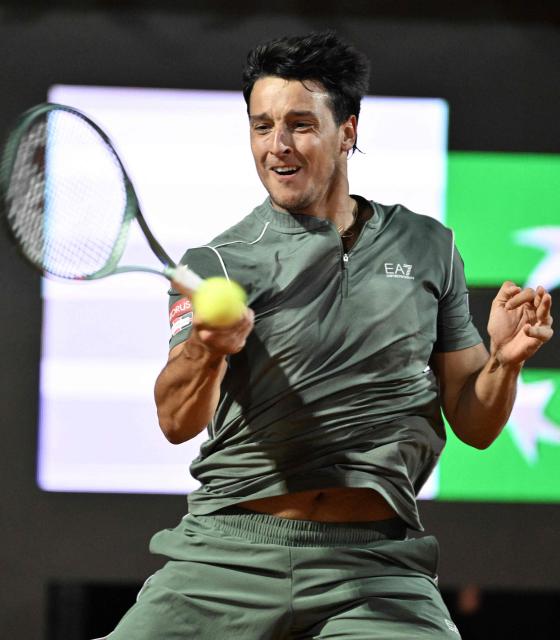 Italy's Luciano Darderi hits a return to Spain's Rafael Jodar during the ATP Rome Open tennis tournament at Foro Italico in Rome on May 13, 2026. (Photo by Tiziana FABI / AFP)