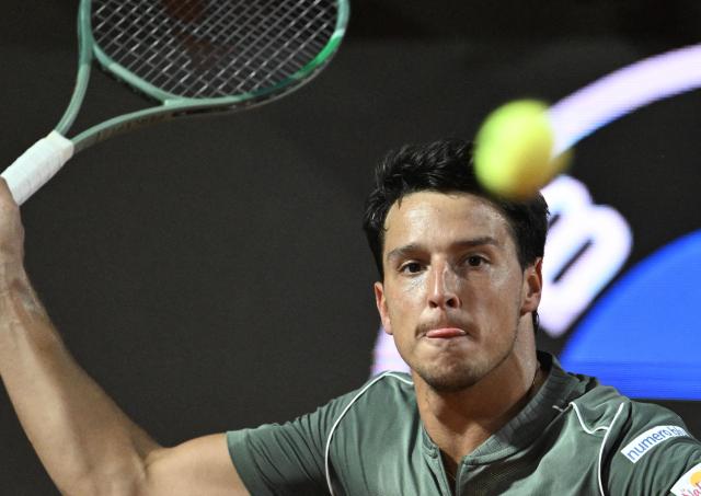 Italy's Luciano Darderi hits a return to Spain's Rafael Jodar during the ATP Rome Open tennis tournament at Foro Italico in Rome on May 13, 2026. (Photo by Tiziana FABI / AFP)
