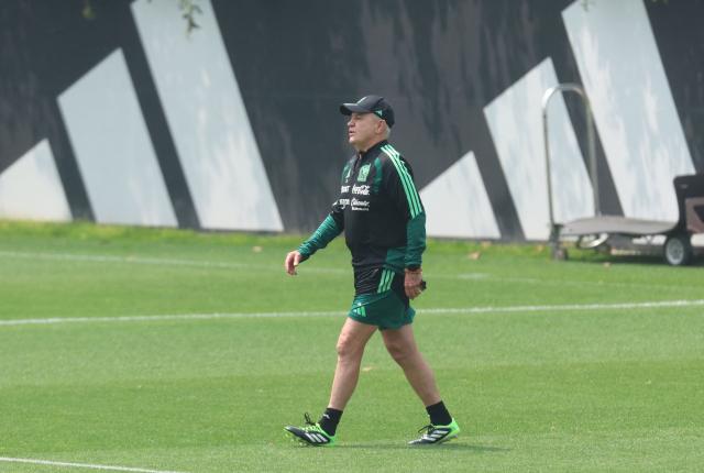Mexico's head coach Javier Aguirre walks on the pitch during a training session at the high-performance centre in Mexico City May 13, 2026. Mexico will play three friendly matches, against Ghana, Australia and Serbia, before the start of the 2026 FIFA world cup. (Photo by LUIS CORTES / AFP)
