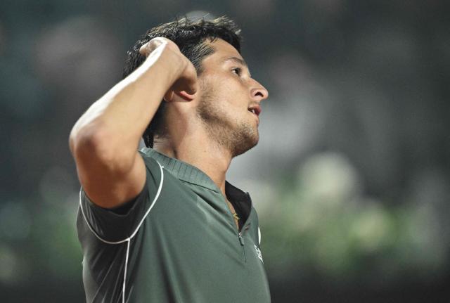 Italy's Luciano Darderi reacts during the match against Spain's Rafael Jodar during the ATP Rome Open tennis tournament at Foro Italico in Rome on May 13, 2026. (Photo by Tiziana FABI / AFP)