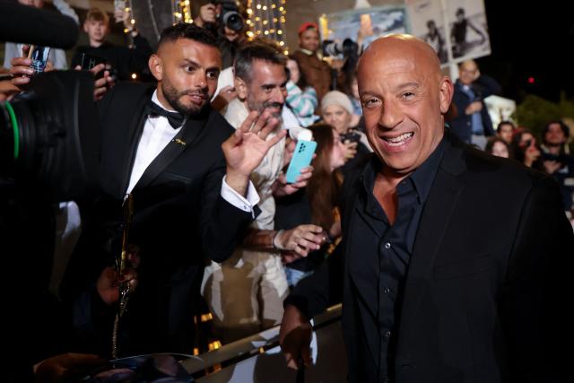 US actor Vin Diesel reacts as he arrives for the screening of the film "The Fast and the Furious" at the 79th edition of the Cannes Film Festival in Cannes, southern France on May 13, 2026. (Photo by Sameer AL-DOUMY / AFP)