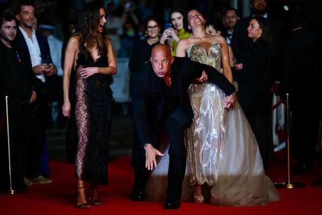 (From L) US actress Jordana Brewster, US actor Vin Diesel and US actress Michelle Rodriguez react as they arrive for the screening of the film "The Fast and the Furious" at the 79th edition of the Cannes Film Festival in Cannes, southern France on May 13, 2026. (Photo by Olivier CHASSIGNOLE / AFP)