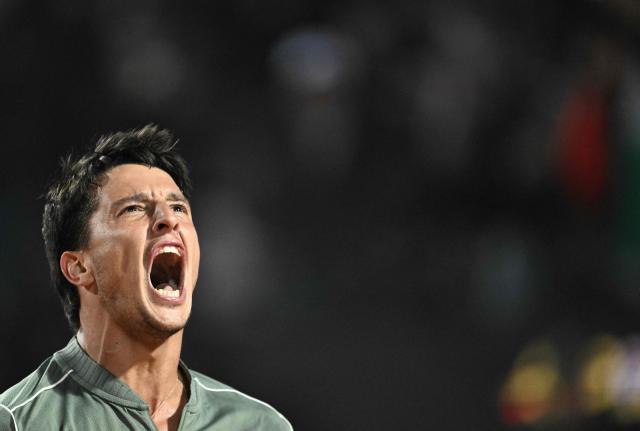 Italy's Luciano Darderi celebrates a point against Spain's Rafael Jodar during the ATP Rome Open tennis tournament at Foro Italico in Rome on May 13, 2026. (Photo by Tiziana FABI / AFP)