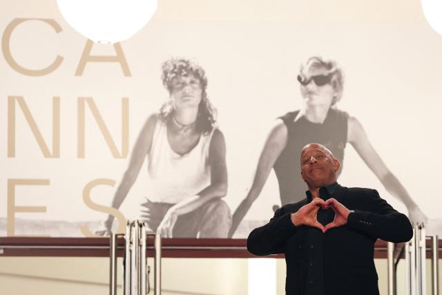 US actor Vin Diesel gestures as he arrives for the screening of the film "The Fast and the Furious" at the 79th edition of the Cannes Film Festival in Cannes, southern France on May 13, 2026. (Photo by Thibaud MORITZ / AFP)