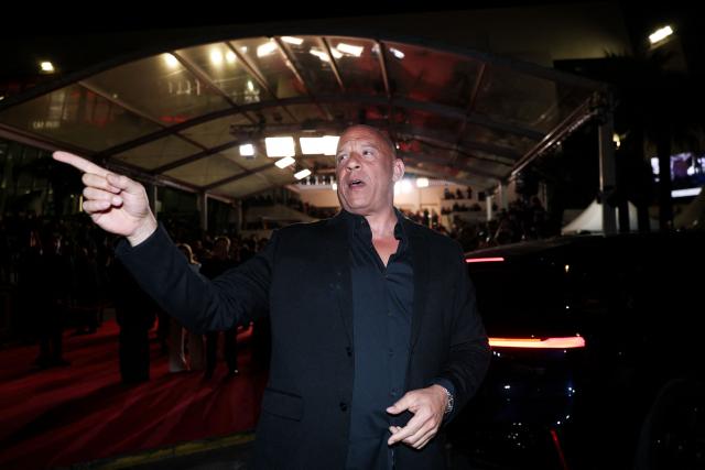 US actor Vin Diesel reacts as he arrives for the screening of the film "The Fast and the Furious" at the 79th edition of the Cannes Film Festival in Cannes, southern France on May 13, 2026. (Photo by Sameer AL-DOUMY / AFP)