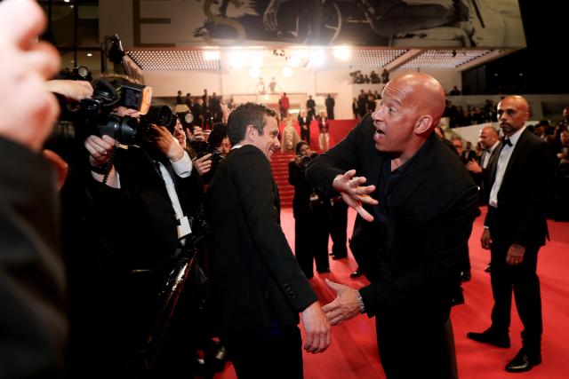 US actor Vin Diesel reacts as he arrives for the screening of the film "The Fast and the Furious" at the 79th edition of the Cannes Film Festival in Cannes, southern France on May 13, 2026. (Photo by Sameer AL-DOUMY / AFP)