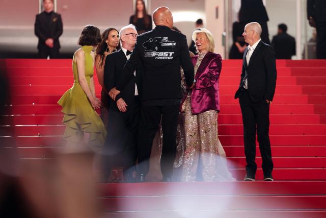 Cannes film festival director Thierry Fremaux (C-L) and German media executive and President of the Cannes Film Festival Iris Knobloch (C-R) greets US actor Vin Diesel upon arrival for the screening of the film "The Fast and the Furious" at the 79th edition of the Cannes Film Festival in Cannes, southern France on May 13, 2026. (Photo by Sameer AL-DOUMY / AFP)