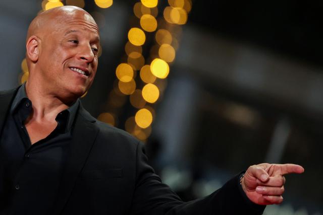 US actor Vin Diesel gestures as he arrives for the screening of the film "The Fast and the Furious" at the 79th edition of the Cannes Film Festival in Cannes, southern France on May 13, 2026. (Photo by Thibaud MORITZ / AFP)