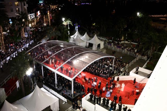 This aerial photograph shows guest arriving on the red carpet before the screening of the film "The Fast and the Furious" at the 79th edition of the Cannes Film Festival in Cannes, southern France on May 13, 2026. (Photo by Ian LANGSDON / AFP)