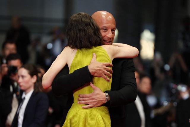 US actor Vin Diesel embraces US model and actress Meadow Rain Walker as they arrive for the screening of the film "The Fast and the Furious" at the 79th edition of the Cannes Film Festival in Cannes, southern France on May 13, 2026. (Photo by Thibaud MORITZ / AFP)