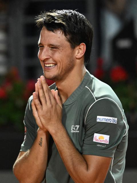 Italy's Luciano Darderi celebrates after winning against Spain's Rafael Jodar during the ATP Rome Open tennis tournament at Foro Italico in Rome on May 14, 2026. (Photo by Tiziana FABI / AFP)