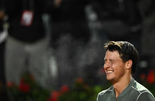 Italy's Luciano Darderi celebrates after winning against Spain's Rafael Jodar during the ATP Rome Open tennis tournament at Foro Italico in Rome on May 14, 2026. (Photo by Tiziana FABI / AFP)