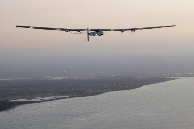 (FILES) The Solar Impulse 2 solar powered airplane flies off Kapolei, Hawaii, on March 3, 2016 on a all-day test flight. Bertrand Piccards pioneering aircraft, which completed a round-the-world flight in 2016 using electric batteries, crashed into the sea in the Gulf of Mexico after being converted into a drone, according to its owner in the United States. In July 2016, Solar Impulse 2 completed a historic round-the-world flight in Abu Dhabi, flying day and night on solar power and without a drop of fuel after a journey of 23 actual flight days and 43,041 km. (Photo by Eugene TANNER / AFP)