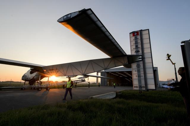 (FILES) Sun-powered plane Solar Impulse 2 HB-SIB is seen during its first exit for test on April 14, 2014 in Payerne, a year ahead of their planned round-the-world flight. Bertrand Piccards pioneering aircraft, which completed a round-the-world flight in 2016 using electric batteries, crashed into the sea in the Gulf of Mexico after being converted into a drone, according to its owner in the United States. In July 2016, Solar Impulse 2 completed a historic round-the-world flight in Abu Dhabi, flying day and night on solar power and without a drop of fuel after a journey of 23 actual flight days and 43,041 km. (Photo by Fabrice COFFRINI / AFP)