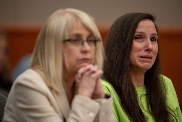(FILES) Kouri Richins reacts as her brother, Ronney Darden, speaks on her behalf during her sentencing in 3rd District Court on May 13, 2026 in Park City, Utah. Kouri Richins, an American woman who made headlines by writing a children's book about grief after poisoning her husband, was sentenced to life in prison without the possibility of parole on May 13, 2026, US media reported. (Photo by Trent NELSON / POOL / AFP)