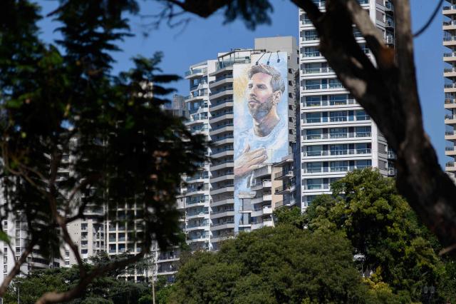 A mural of Argentine footballer Lionel Messi is seen on a residential building in Rosario, Santa Fe province, Argentina, on April 30, 2026. At the age of 12, Lionel Messi ended the career of his first coach. When Enrique Dominguez stopped coaching him in 1999 at the youth club Malvinas Argentinas in the city of Rosario, he resigned, saying he had "already coached the best player in the world", who could now be set to play in his sixth World Cup. (Photo by Marcelo Manera / AFP)