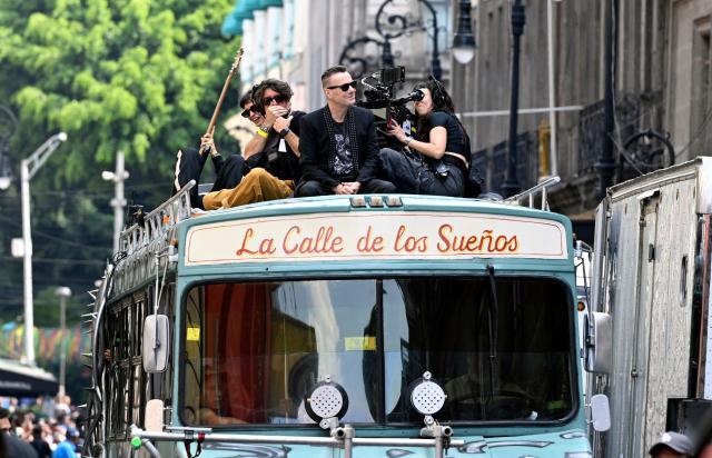 U2 drummer Larry Mullen Jr. (C) is seen during the second day of recording of its music video in downtown Mexico City on May 13, 2026. (Photo by Alfredo ESTRELLA / AFP)