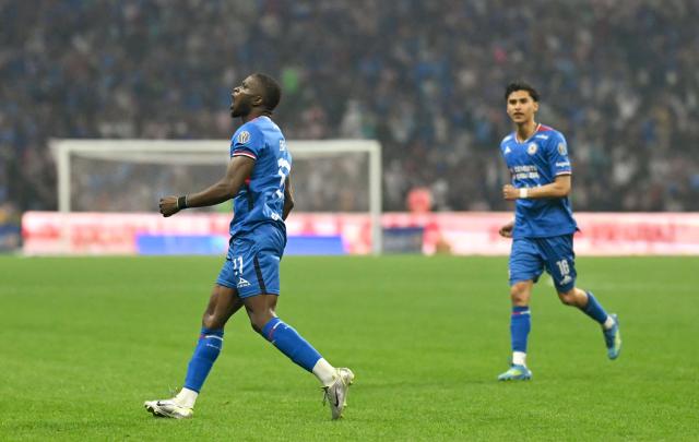 Cruz Azul's Nigerian forward #11 Christian Ebere celebrates after scoring the equalising goal from the penalty spot during the Liga MX Clausura semifinal first-leg football match between Cruz Azul and Guadalajara at Banorte Stadium in Mexico City on May 13, 2026. (Photo by CARL DE SOUZA / AFP)