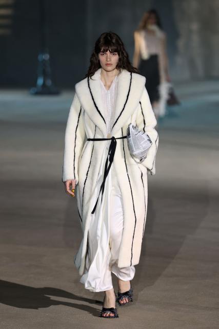 A model walks the runway during the Dior 2027 Cruise collection fashion show at the Los Angeles County Museum of Art (LACMA) in Los Angeles on May 13, 2026. (Photo by Patrick T. Fallon / AFP)