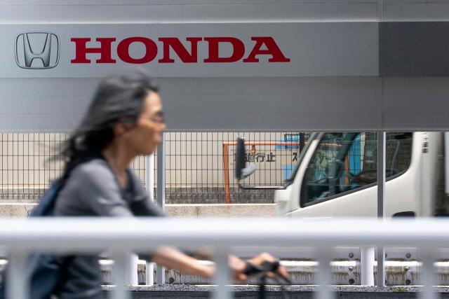 The logo of Japanese automaker Honda is seen at a Honda dealership in Tokyo on May 14, 2026. (Photo by Kazuhiro NOGI / AFP)