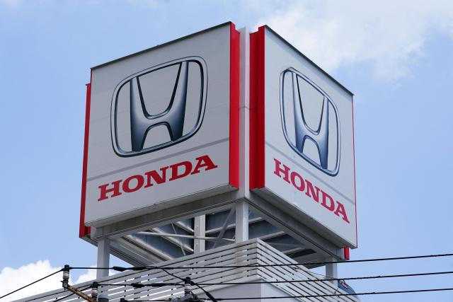 The logo of Japanese automaker Honda is pictured on a billboard at a Honda dealership in Tokyo on May 14, 2026. (Photo by Kazuhiro NOGI / AFP)
