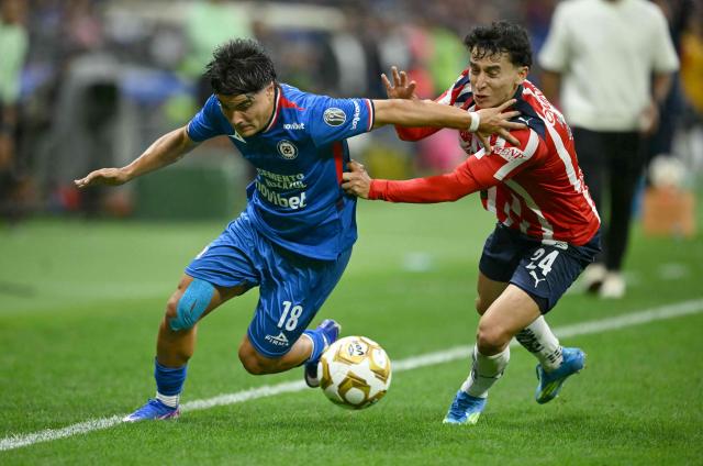 Cruz Azul's forward #18 Luka Romero AND Guadalajara's defender #24 Miguel Gomez fight for the ball during the Liga MX Clausura semifinal first-leg football match between Cruz Azul and Guadalajara at Banorte Stadium in Mexico City on May 13, 2026. (Photo by CARL DE SOUZA / AFP)